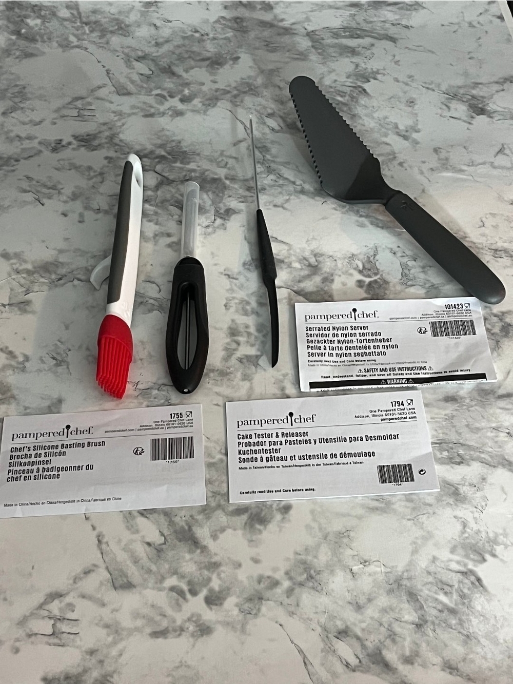 Authentic Pampered Chef 4-piece kitchen utensil lot, all in like-new condition.